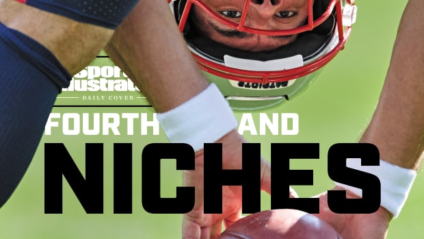 Patriots long snapper Joe Cardona looks back between his legs